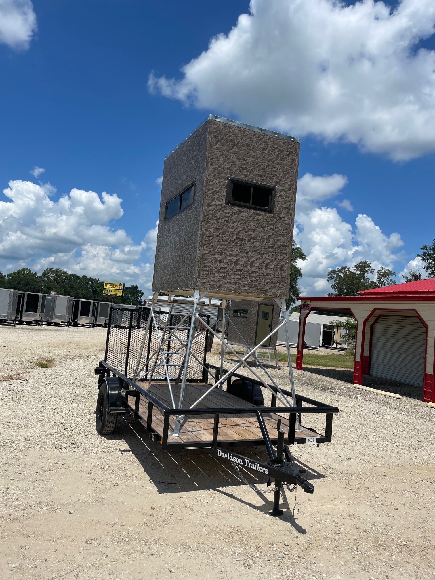 Deer stand loaded on utility trailer