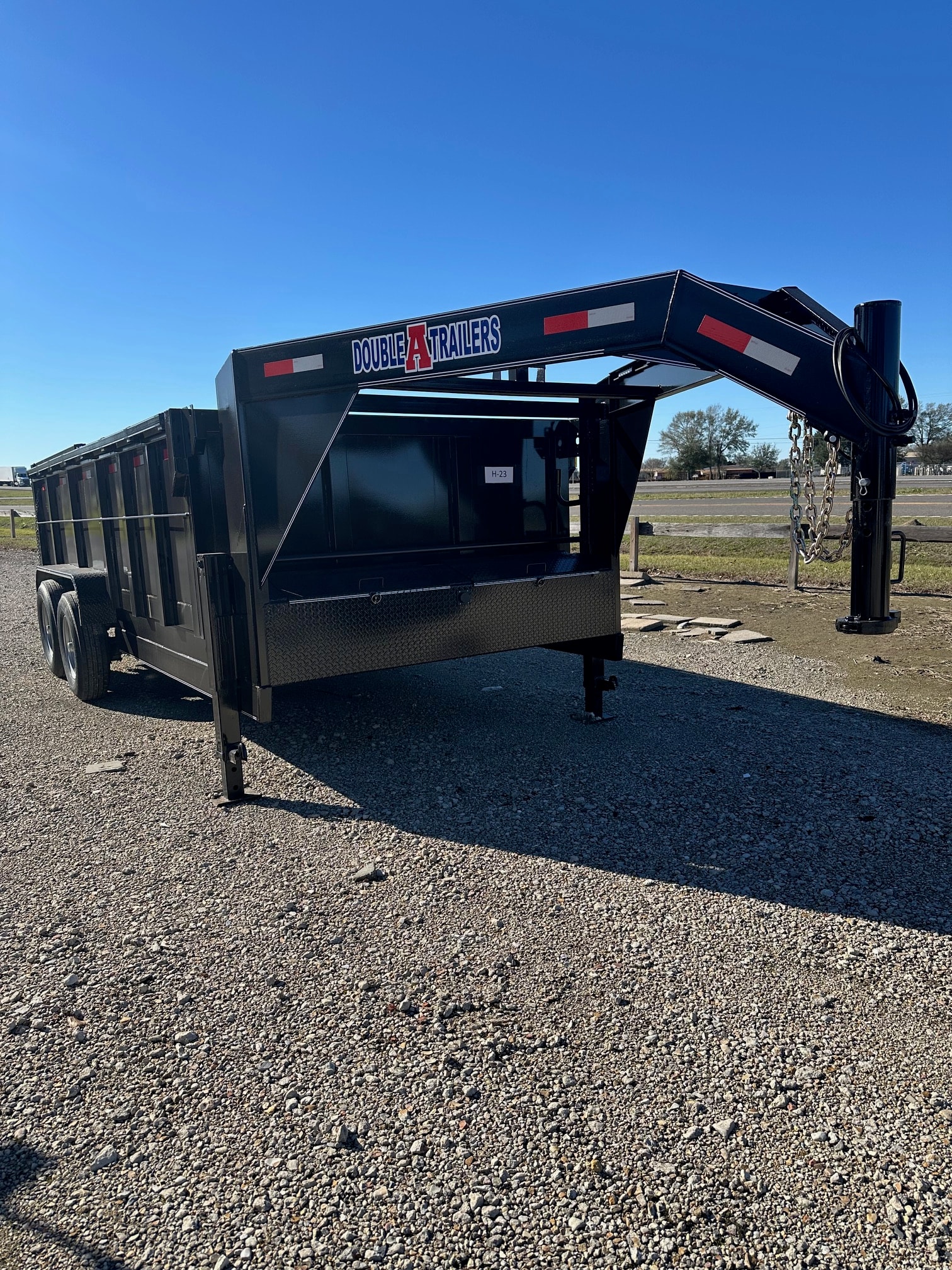 Double A gooseneck dump trailer front view at Delta Trailer Sales
