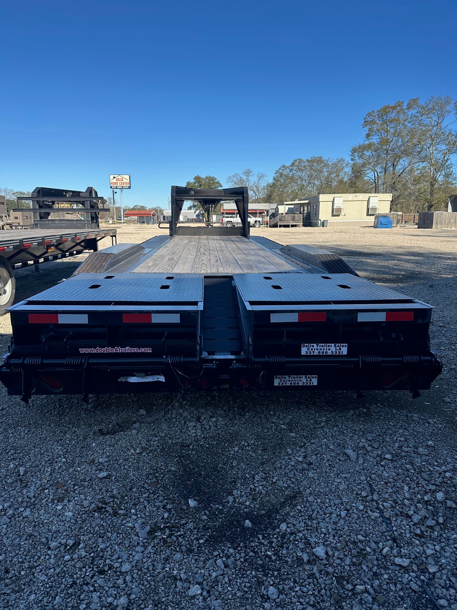 Double A gooseneck trailer with mega ramps at Delta Trailer Sales